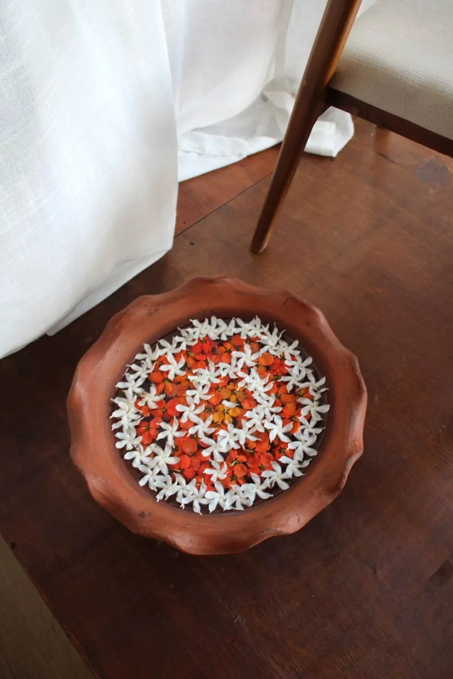 Flower petal ritual bowl at Praanadha Ayurveda Wellness