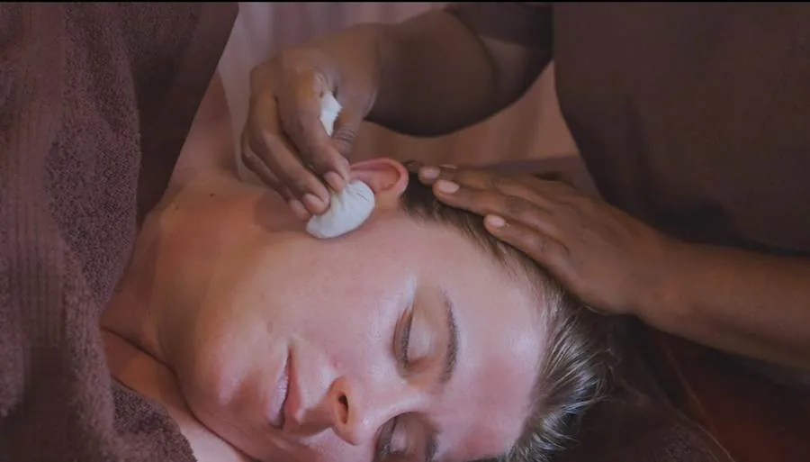 Warm herbal compress massage at Praanadha Ayurveda Wellness